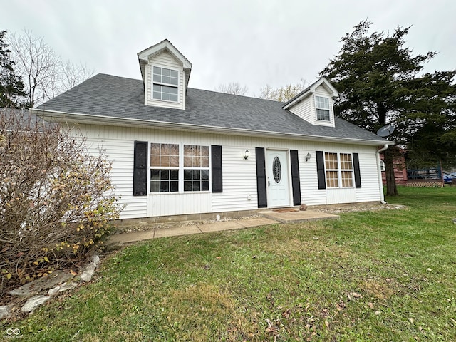 cape cod-style house with a front lawn