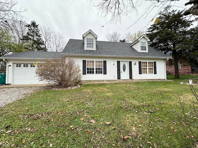 cape cod-style house featuring a garage and a front yard