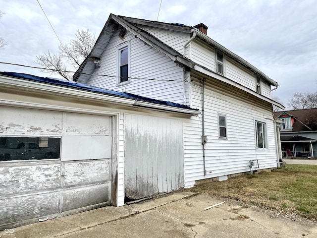 view of home's exterior with a garage