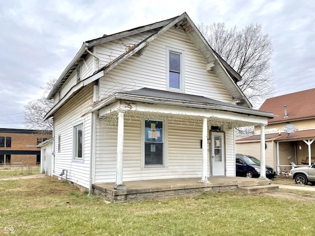 bungalow featuring a front yard and covered porch