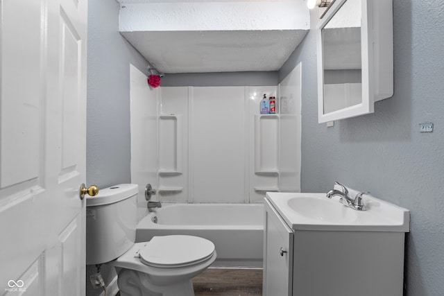 full bathroom featuring hardwood / wood-style flooring, vanity, toilet, and tub / shower combination