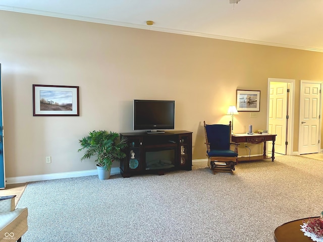 carpeted living room featuring ornamental molding