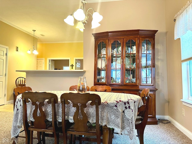 dining area featuring light carpet, ornamental molding, and a notable chandelier