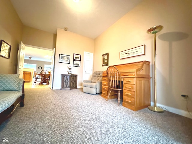 home office featuring carpet floors and vaulted ceiling