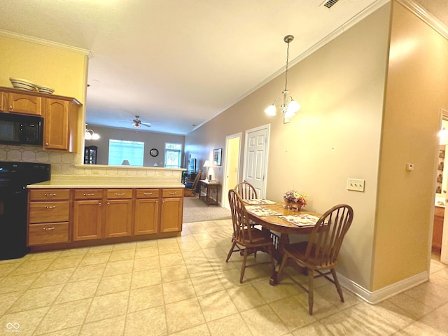 kitchen featuring ceiling fan with notable chandelier, decorative light fixtures, ornamental molding, and black appliances