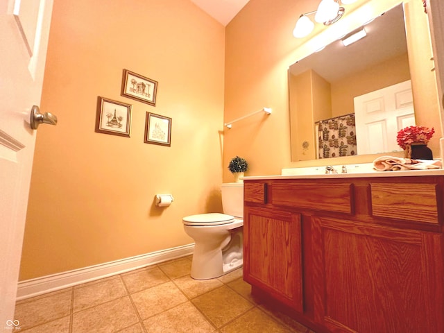 bathroom with tile patterned floors, vanity, and toilet