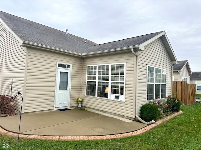 rear view of property featuring a patio