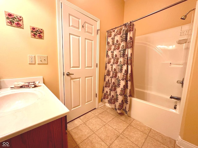 bathroom featuring tile patterned floors, vanity, and shower / tub combo