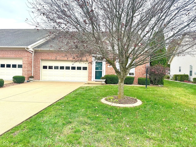 view of front of home featuring a garage and a front lawn