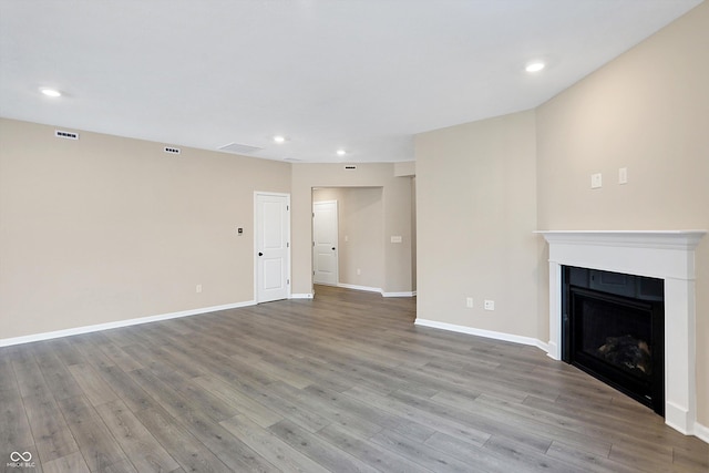 unfurnished living room with light wood-type flooring