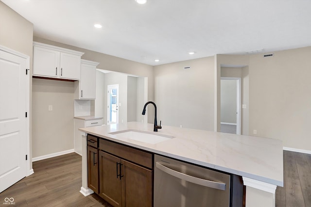 kitchen featuring sink, white cabinetry, a kitchen island with sink, light stone countertops, and stainless steel dishwasher