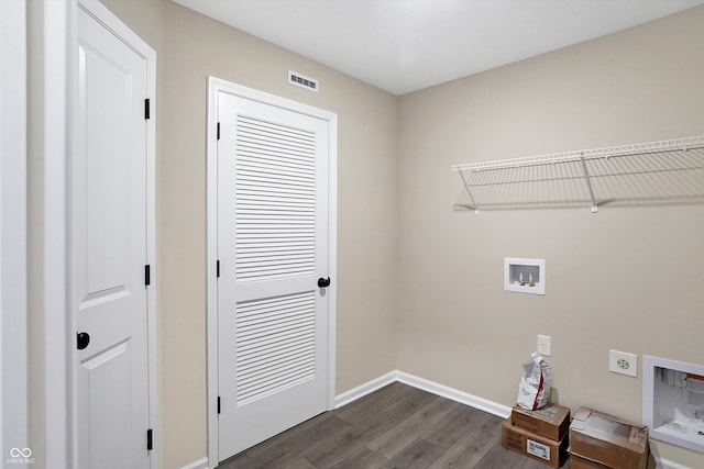 laundry area featuring hookup for a washing machine, electric dryer hookup, and dark hardwood / wood-style flooring