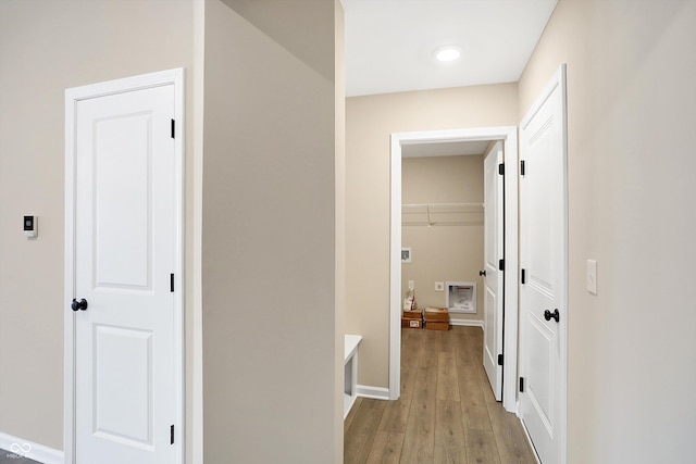 hall with light hardwood / wood-style floors