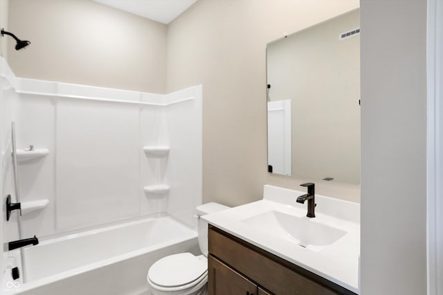 full bathroom featuring vanity, bathtub / shower combination, and toilet