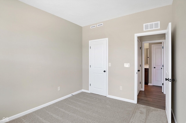 unfurnished bedroom with carpet floors