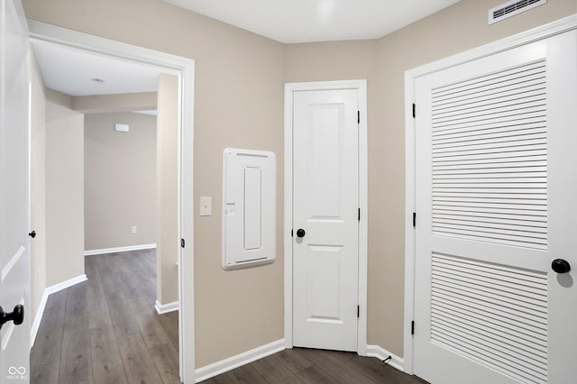 corridor featuring dark hardwood / wood-style floors