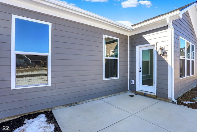 entrance to property with a patio area