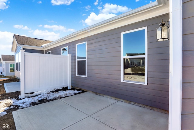 view of snow covered exterior featuring a patio