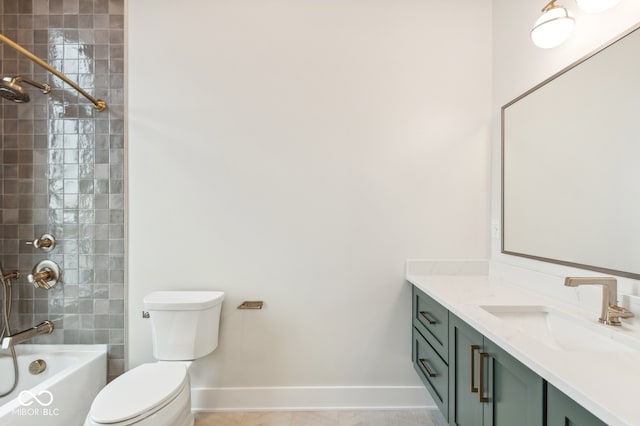 full bathroom featuring tile patterned flooring, vanity, toilet, and tiled shower / bath