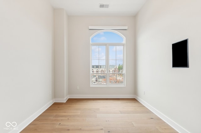 spare room featuring light hardwood / wood-style floors