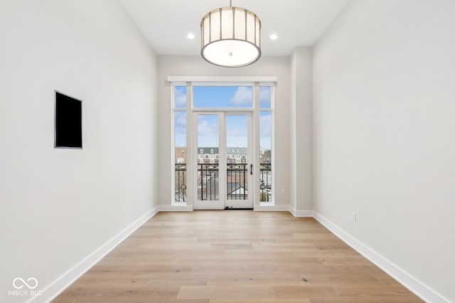 spare room with light hardwood / wood-style flooring