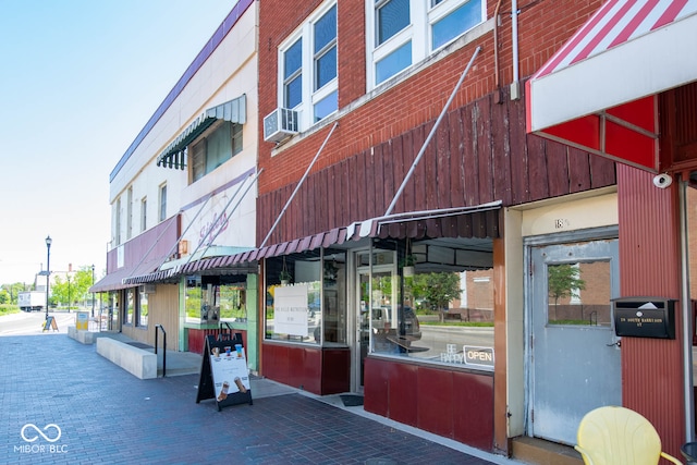 view of building exterior with cooling unit