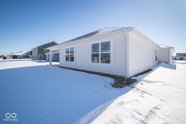 view of snow covered property