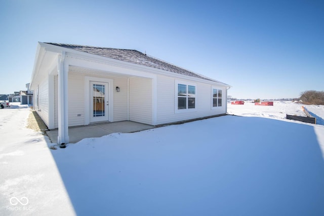 view of snow covered house