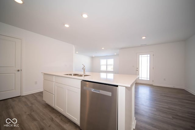 kitchen with dishwasher, dark hardwood / wood-style floors, an island with sink, white cabinetry, and sink