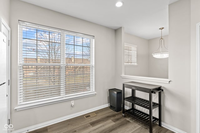 dining room with dark hardwood / wood-style floors