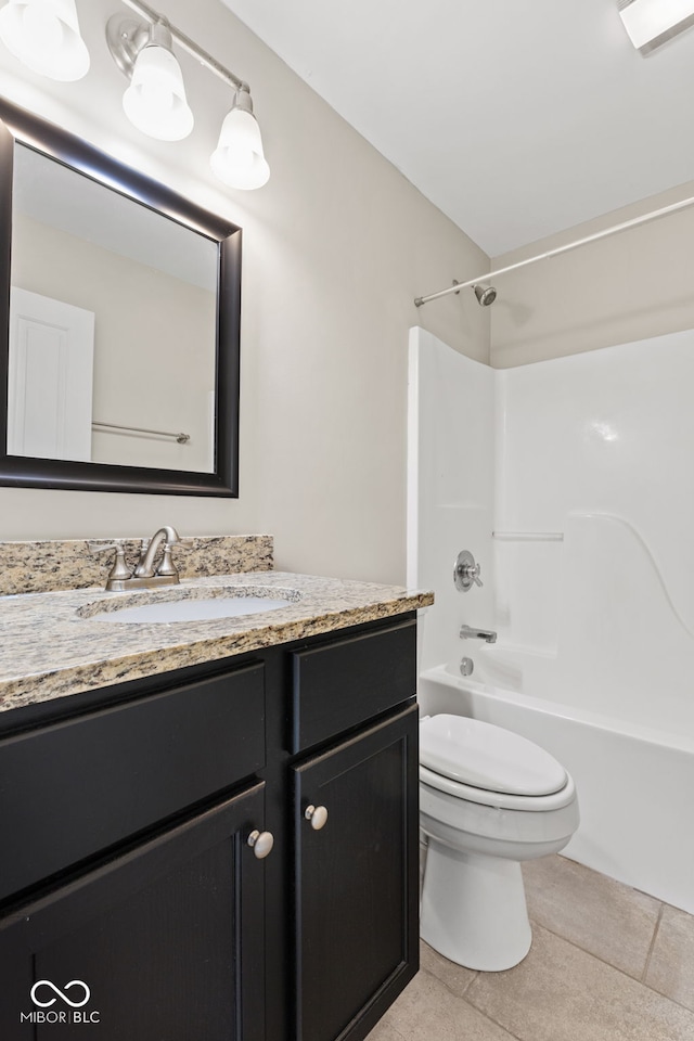 full bathroom featuring tile patterned flooring, vanity, toilet, and shower / washtub combination