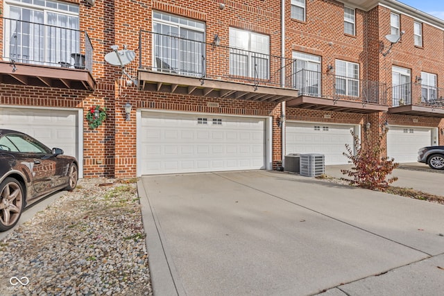 exterior space featuring central AC and a garage