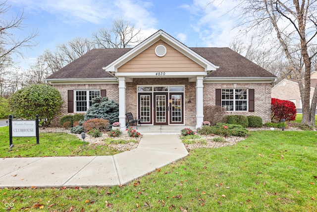 view of front of home featuring a front yard and a porch