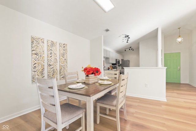 dining room with light wood-type flooring