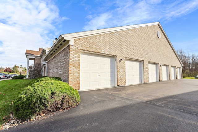 view of side of home with a garage