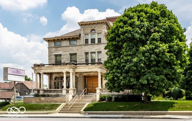 italianate house featuring covered porch