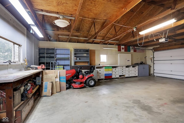 garage featuring a workshop area and a garage door opener