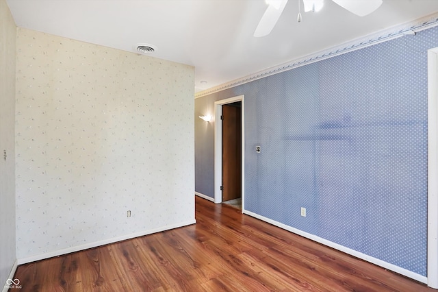 empty room featuring ceiling fan and wood-type flooring