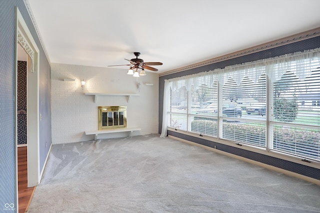 unfurnished living room with carpet and ceiling fan