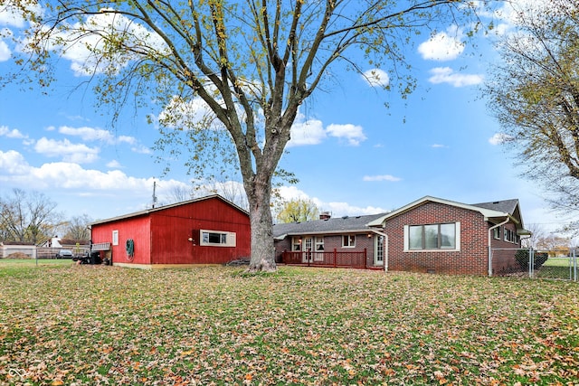 exterior space with a lawn and an outdoor structure