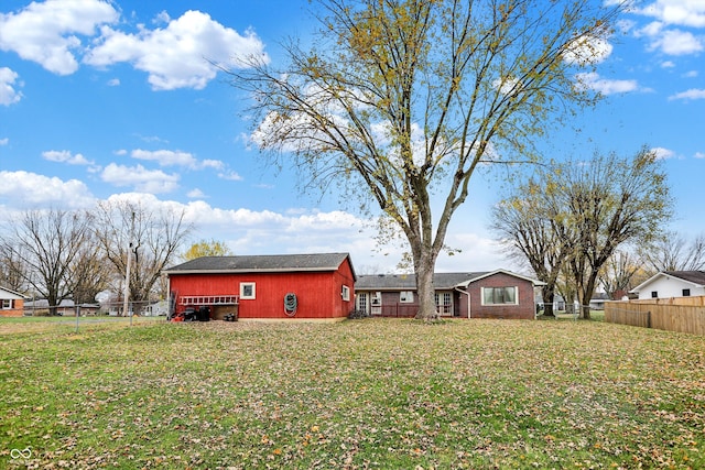 exterior space with a yard and an outbuilding