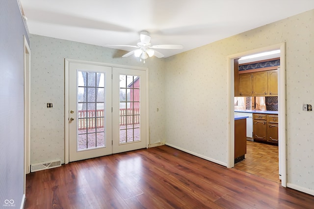 doorway with hardwood / wood-style floors and ceiling fan