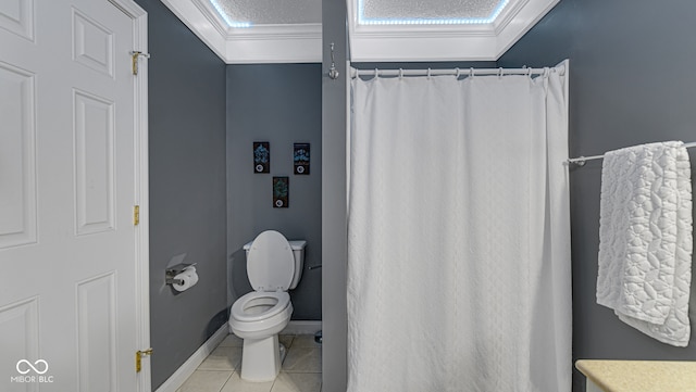 full bath with toilet, tile patterned flooring, ornamental molding, and baseboards