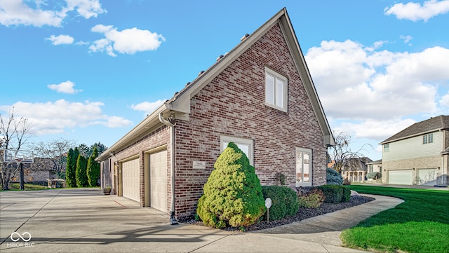 view of property exterior with driveway, brick siding, a lawn, and an attached garage