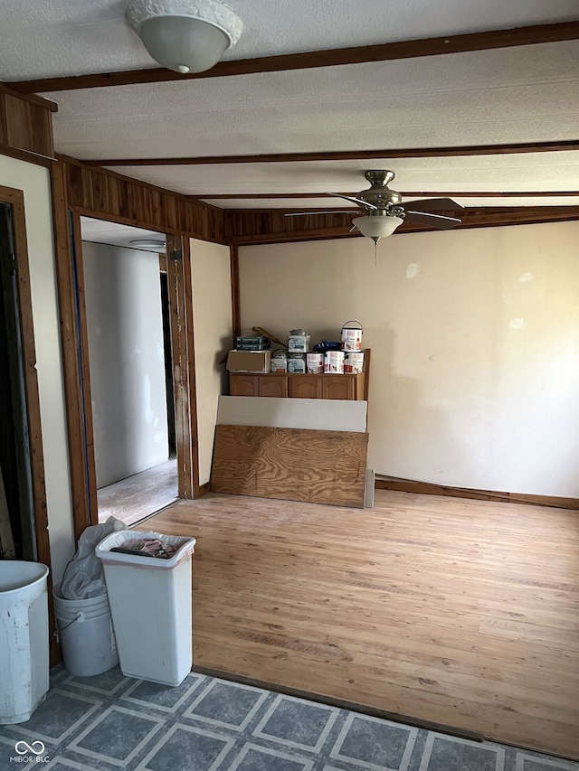 interior space featuring hardwood / wood-style flooring and a textured ceiling