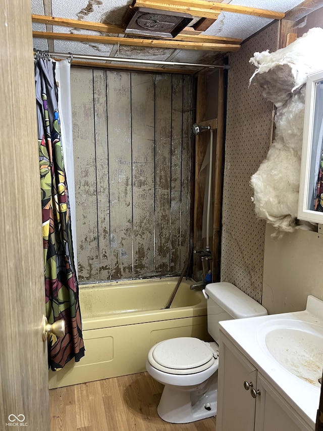 full bathroom with hardwood / wood-style floors, vanity, toilet, and shower / bath combo