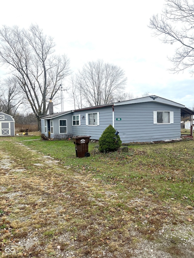 back of house featuring a yard