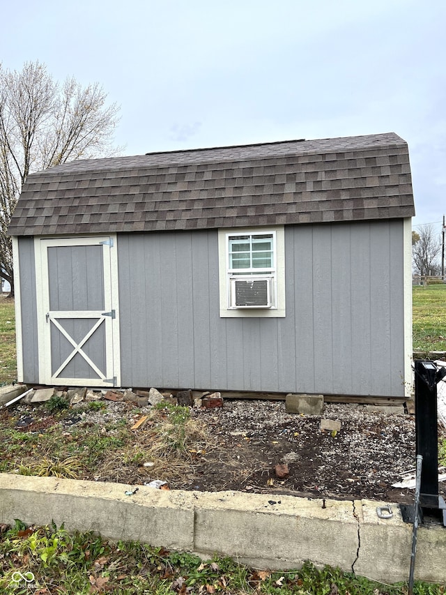 view of outbuilding featuring cooling unit