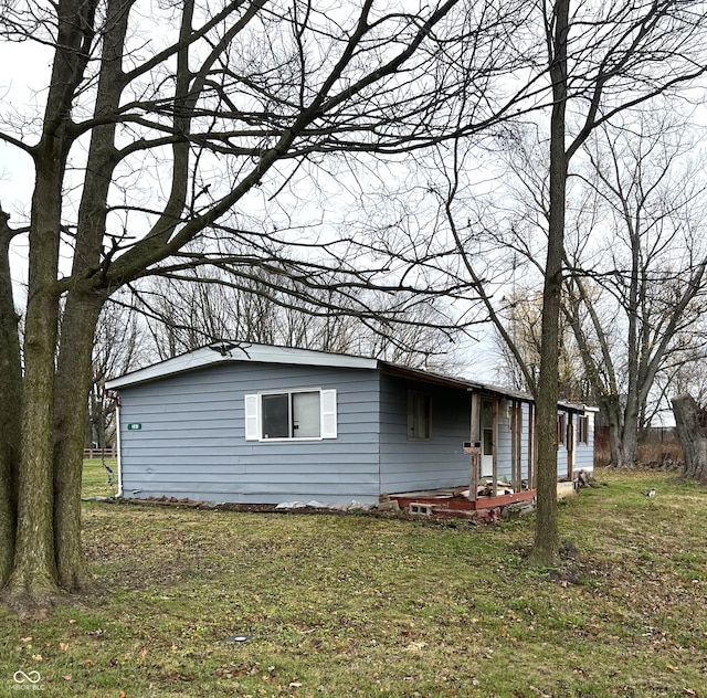 view of property exterior with a lawn