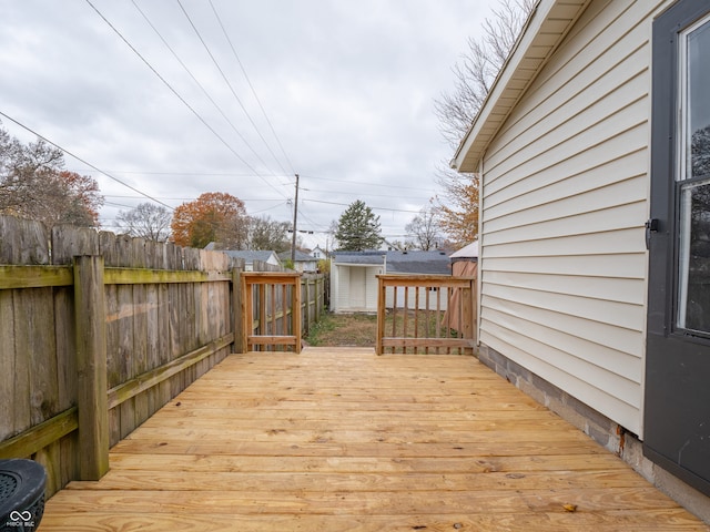 wooden deck with a shed